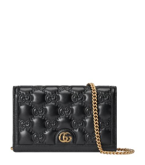 GG Matelassé chain wallet in black leather .